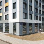 Modern comfort-class real estate: Novy Zelenograd facade by SPEECH, grey-white panels with bright yellow balcony inserts.
