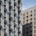 Облицовка фасада ЖК Квартал на воде: темный металл, структурное остекление и серая плитка, Печатники, Москва