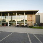 Фрагмент остекления и вывеска ТРЦ Небо, улица Авиаторов, Москва