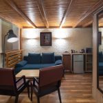 What makes a two-storeyed hotel room so appealing? This professional interior photo by Kirill Toll captures the spacious single-room zone, highlighting its modern design and comfort. Professional hotel photography for your business.