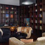 An inviting bedroom scene showcasing plush bedding and soft lighting. This is the power of professional hotel photography by Kirill Toll: creating an immediate emotional connection and desire to experience the space firsthand.