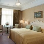 Wide-angle hotel room photography capturing the complete space. This professional image by Kirill Toll shows effective composition and lighting. Available for hotel photography projects throughout Moscow region and Russia.