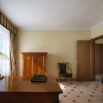 Capturing the essence of hotel luxury: a detailed shot of a corridor or lounge area. Kirill Toll's professional photography services focus on ambiance and high-end finishes, providing assets that justify a premium price point.