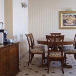 A serene and minimalist hotel interior, professionally photographed by Kirill Toll. The use of natural light and clean lines creates a sense of tranquility, a key selling point that high-quality photography communicates instantly.