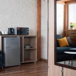 Why invest in professional interior photography for your hotel? This image of a two-storey room by Kirill Toll demonstrates how quality visuals can showcase space and design, attracting more guests. Expert hospitality photography.