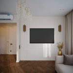 Интерьер гостиной в ЖК Level Причальный: телевизор на стене с классическими молдингами, золотые настенные бра.