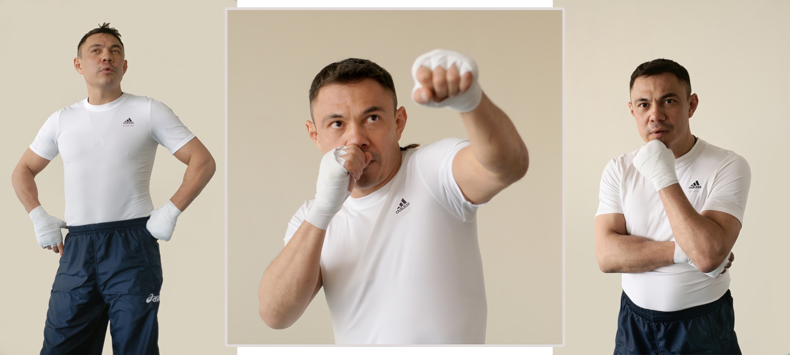 портрет боксера. Мужчина в белой футболке Adidas с бинтами на руках стоит руки на бёдрах, взгляд вверх, светло-бежевый фон